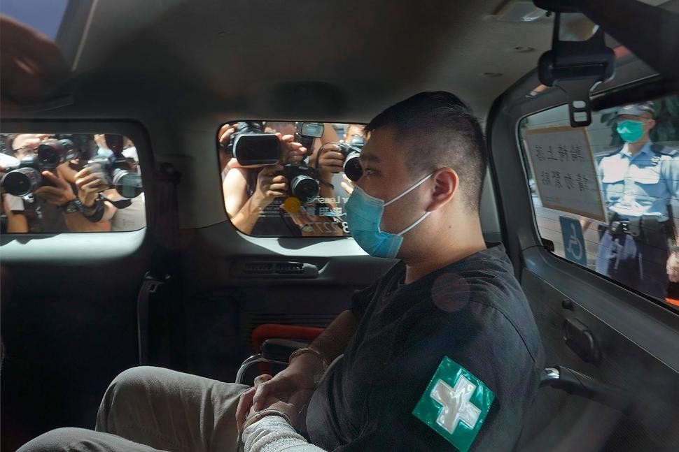 Tong Ying-kit, 23 years old, arrives at a court for the violation of the new security law after carrying a flag reading "Liberate Hong Kong, Revolution of our times" during a protest in Hong Kong. Tong has been sentenced to nine years in prison in the closely watched first case under Hong Kong’s national security law as Beijing tightens control over the territory. (AP Photo/Vincent Yu, File)